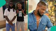 Burna Boy meets Peter Okoye's son, pictures get mixed reactions: "He is doing gangster things"