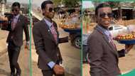 "My eyes have seen wonders in Abuja": Lady shares video of unique kola nut hawker dressed in suit