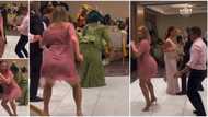 Pretty Oyinbo lady on short gown & heels twerks at small Nigerian wedding, guests paused to watch her in video