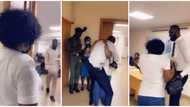 Canada-based Nigerian wife surprises husband at his bank workplace after 6 years away, sings for him in video