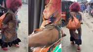 "Mama no wan leave drip": Old woman steps out with artificial nails, lipstick and dark shades