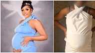 She should have just tied white bedsheet - Reactions as pregnant lady posts photos of dress she ordered
