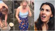 Pretty barefooted Oyinbo lady spotted in wrapper using Nigerian grinding stone and speaking pidgin in video