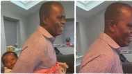 Nigerian man goes for Omugwo, backs grandson in funny video, daughter hails his skills