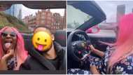 New boo? DJ Cuppy takes a spin in her Ferrari with mystery man, keeps his face hidden