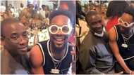 It's an awkward video: Mixed reactions as Patoranking sits on fuji singer Kwam 1's laps at a party