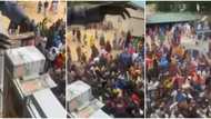 Aboki Cubana: Reactions as Nigerian man shows off bundles as he makes cash rain from compound balcony in video