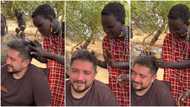 "What did she see?" Black girl sees Oyinbo man, examines his curly hair with surprise, video goes viral