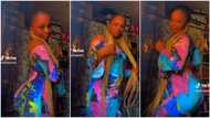 "You're pretty": Curvy lady in long braids & tight gown shakes waist, men beg for her attention