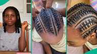 10-year-old Nigerian girl neatly braids her younger sister's hair like pro, video wows everyone