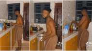 "Continue nah": Nigerian lady mocks her confused boyfriend as he cooks rubbish in the kitchen in viral video