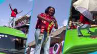 Nana Ama McBrown climbs on top of a bus to film a commercial, video frightens fans