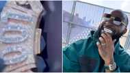 Davido shows off his new customised "001" diamond necklace, fans react to the video: "Who dey drag 001 wit am"