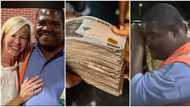 "It will help me": Store attendant who has worked for over 20 years receives N13.3m cash gift, photos emerge