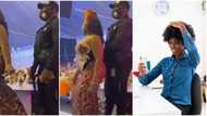 Bouncer stands like a robot as female guest at wedding rocked him softly with her backside, video goes viral