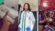 Nigerian lady displays massive gift items her new male neighbour gives her, video generates buzz