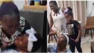 Video shows woman rolling on the floor and screaming in excitement as daughter arrives from US after 10 years