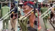 Corper in uniform visits mum's roadside shop to salute her in video, people react
