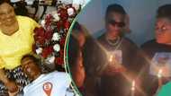 Wizkid looks heartbroken among family members as they hold candlelight processions for his late mum