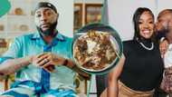 Davido enjoys sumptuous delicacy, clears his plate, fans react: "Get you a wife that can cook"