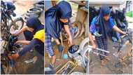 Hardworking Nigerian lady in hijab shows strength, dismantles okada with speed in video