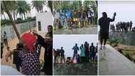 Free concert: Davido gets group of kids excited as he performs for them on the fence of his beach house