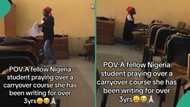 Video shows female student praying over carryover course she has been writing for over 3 years