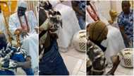 Portable: Ooni of Ife gifts singer bundle of cash, singer quickly hides it inside trousers to avoid 'ripping'