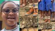 NYSC lady captures video of school boy wearing 'corper' shoes and stockings on assembly ground