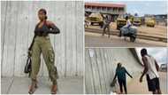 Lady wants to take pictures in Lagos, thugs challenge her, demand payment in video