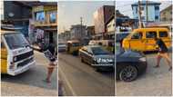 "Come try am for Ibadan": Young Nigerian man jumps in front of car, sits on the road & causes traffic in video