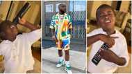 Talent full ground: Nigerian boy uses remote control as mic, sings "Stand Strong" by Davido, video goes viral