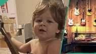 Young kid with small guitar performs and sings effortlessly, clip trends