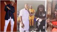 Video shows herbalist spraying money on a popular Nigerian gospel musician at event, stirs massive reactions