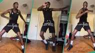 Very tall man above 7 feet dances to Naira Marley's song with head close to ceiling, video trends