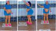 Strong and confident pregnant woman dances inside living room, her baby bump shakes in viral video
