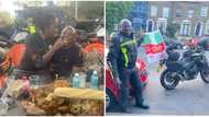 He took the challenge: Brave biker fed by Ivorian lady who sat on his lap in Abidjan, fans tell him to focus