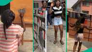 Nigerian lady shows her new artwork, depicts woman selecting book at library