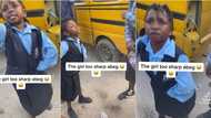 "Beat me na, try am": Little girl on uniform tackles bus conductor, says she won't pay fare, video goes viral