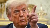 Trump says not firing Fed chair -- but not ruling out