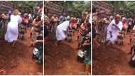 "I cried": Drama as Nigerian woman climbs grandma's grave at burial, dances happily on it in trending video