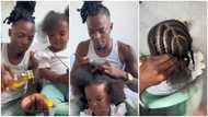 "Daddy wey dey pamper": Loving father melts hearts online with nice styling of daughter's hair