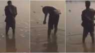 Video showing suspected internet fraudsters spraying bundles of money into river causes stir on social media