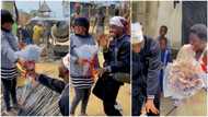 Nigerian man goes on street, gives bundles of N500 notes to strangers, video shows him dancing to Buga