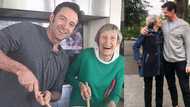 Actor Hugh Jackman hugs his mother years after she abandoned him as a child