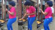 "You are enjoying yourself": Lady in Blue Leggings Dances While Roasting Corn, Video Goes Viral on TikTok