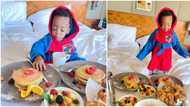Regina Daniels' son Munir dines like a king as he enjoys breakfast in bed while on London vacation with mother