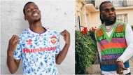 Burna Boy reacts as Man United player Paul Pogba challenges him to a football contest