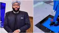 Money good: Many talk as billionaire E-Money walks stylishly on top of TV installed inside his kitchen floor