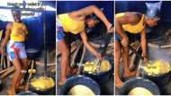 "I sabi cook": Video of pretty Nigerian slay queen turning garri with full force goes viral, stirs reactions